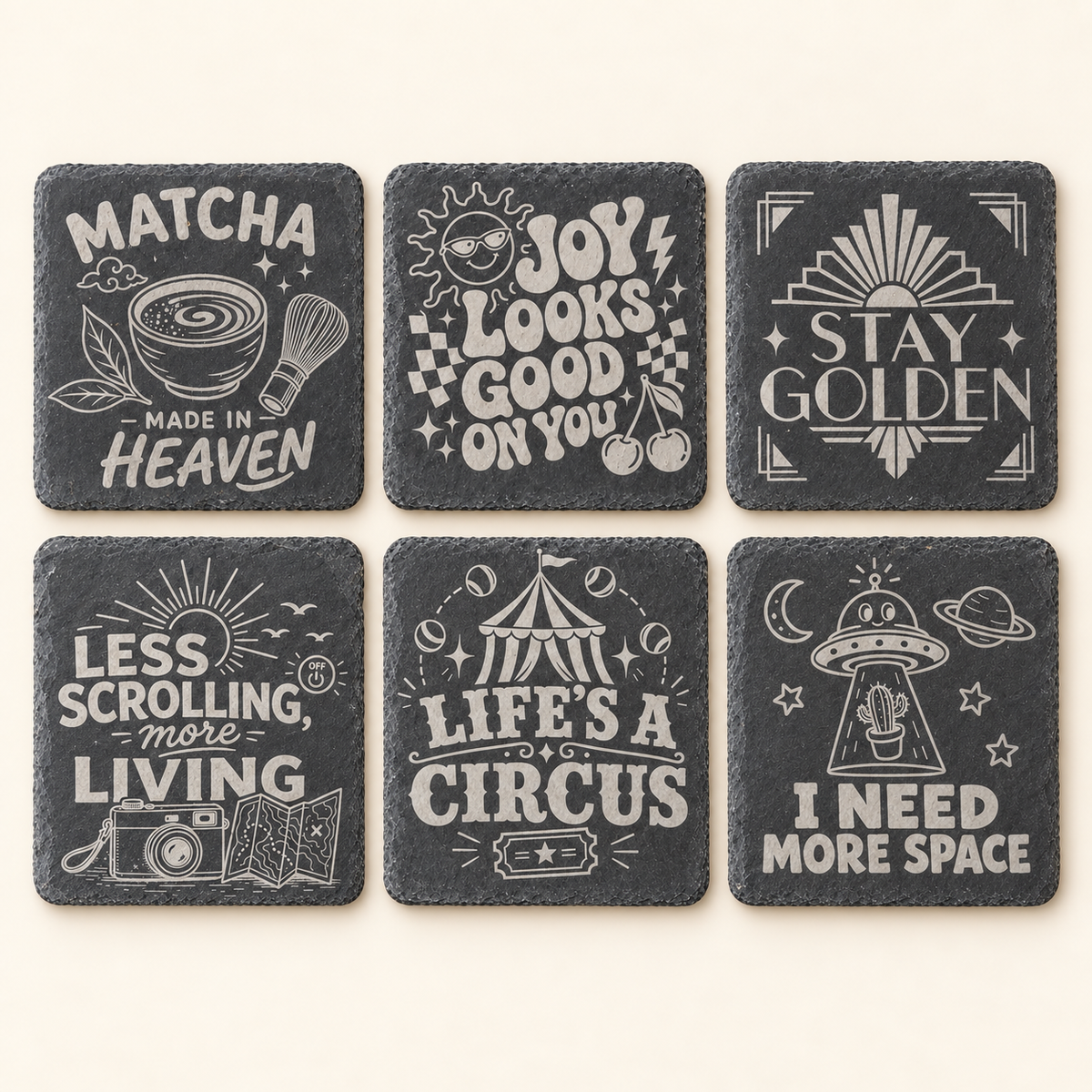 Six engraved square slate coaster designs