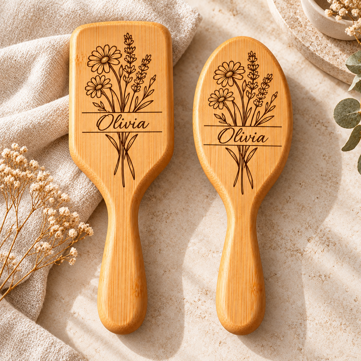 Rectangular and oval personalised bamboo hairbrushes with floral engraving
