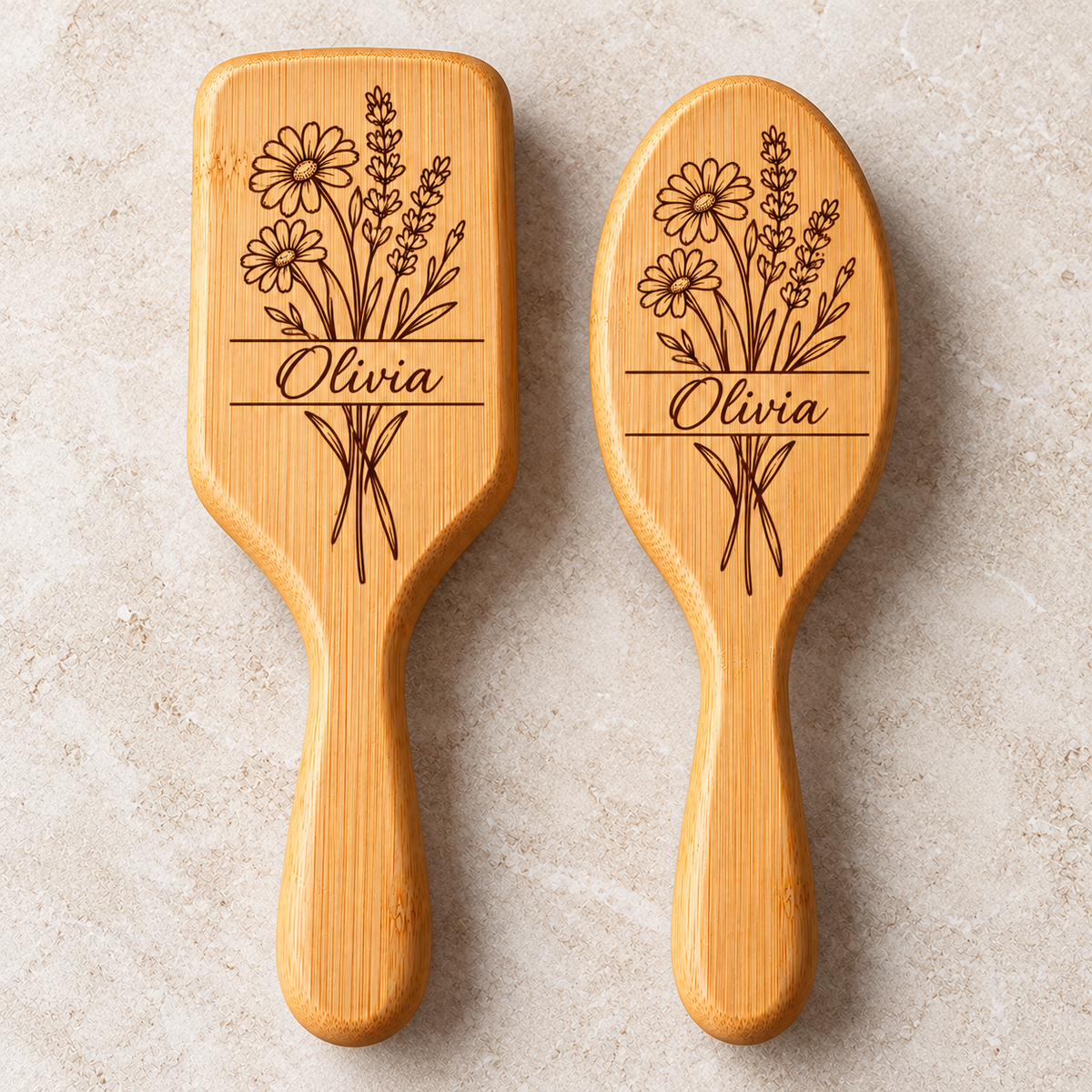 Personalised bamboo hairbrush in rectangular and oval shapes with floral engraving and custom name