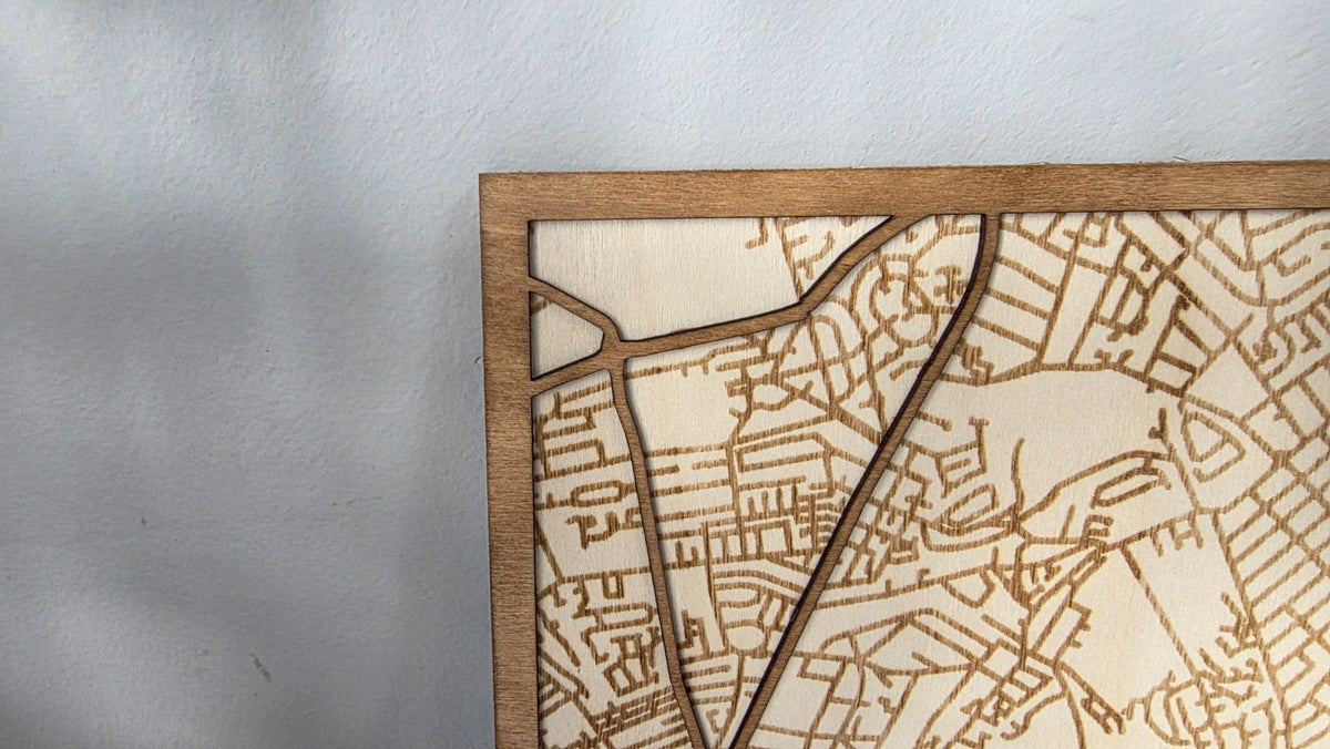 Wooden frame and engraved road details close-up