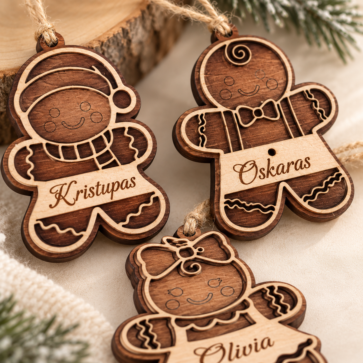 Three personalised wooden gingerbread Christmas ornaments with custom names