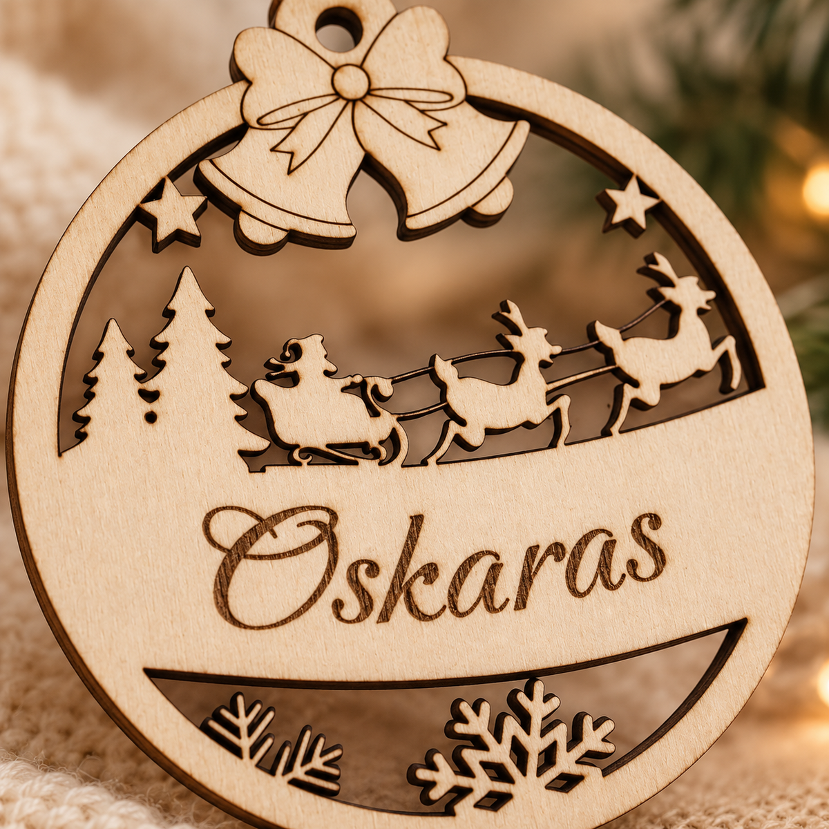 Close-up detail of personalised wooden Christmas ornament engraving and cut design