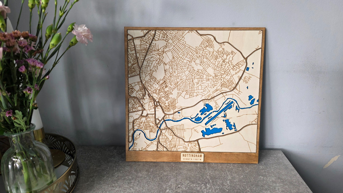 Wooden city map displayed in a home setting